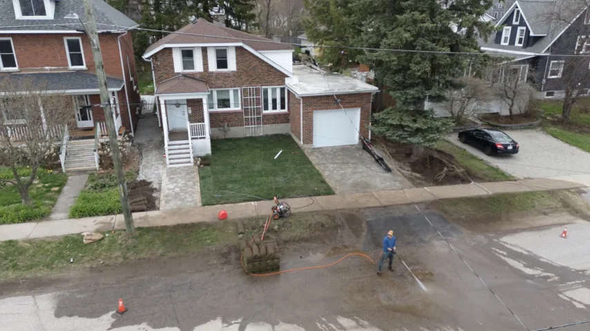 Aerial view of a finished interlock driveway in North Bay.